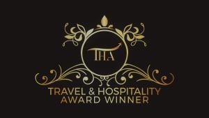 a gold logo for a travel and hospitality award winner at Aqua Mar Condos in Pompano Beach