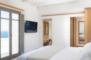 Cama ou camas em um quarto em Mykonos Soul Luxury Suites