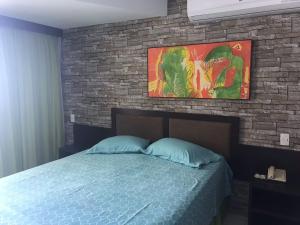 Una cama o camas en una habitación de Flat no Marulhos Resort na praia Muro Alto