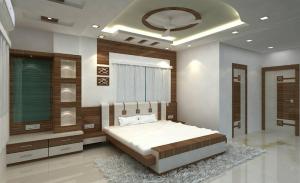 德奥加尔Hotel Shree Hari的一间卧室配有一张带地毯的大床