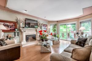 a living room filled with furniture and a fireplace at Diana's Luxury Bed and Breakfast in Vancouver