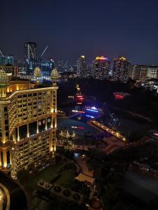 a view of a city skyline at night at Sunway Luxury Suites in Kampong Penaga