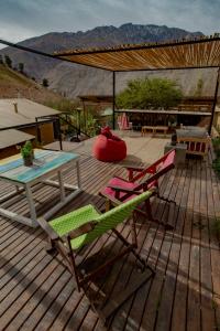 a patio with two chairs and a table and a table at UMA Hotel in Pisco Elqui