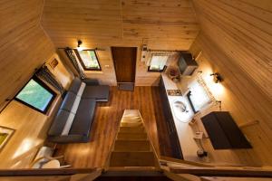 an overhead view of a tiny house with stairs at Na Morenie in Sieraków