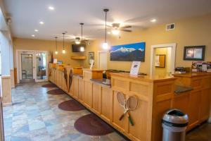 a large room with a counter with scissors on it at Attitash Mountain Village in Bartlett