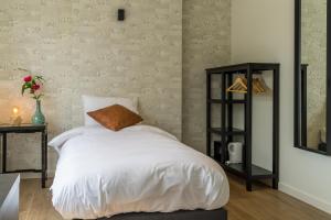 Voodi või voodid majutusasutuse Hotel Huron toas