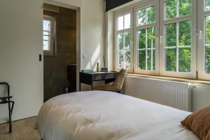 Voodi või voodid majutusasutuse Hotel Huron toas