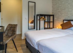 Voodi või voodid majutusasutuse Hotel Huron toas
