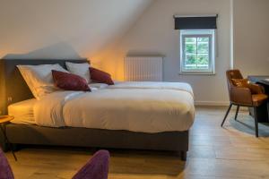 Voodi või voodid majutusasutuse Hotel Huron toas