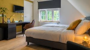 Voodi või voodid majutusasutuse Hotel Huron toas