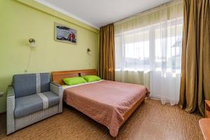 Кровать или кровати в номере Green hotel-club