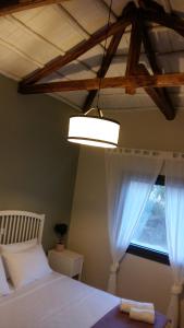 A bed or beds in a room at VILLA ANTHIMOS