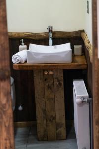 a bathroom with a sink on a wooden vanity at Estancia Dos Elianas in Torres del Paine +35 photos
