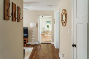 an open hallway with a living room and a dining room at Spacious 2BR Apartment near Airport - Central Charming in Dunning