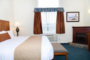 Postel nebo postele na pokoji v ubytování Hinton Lodge