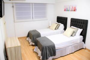 Posteľ alebo postele v izbe v ubytovaní Departamento en Recoleta