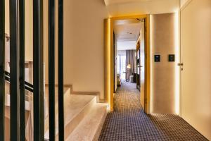 Postel nebo postele na pokoji v ubytování Hotel Kalos