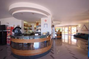 a lobby with a bar in a building at Hotel Residence Isola Verde in Marciana Marina