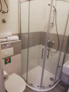 a shower in a bathroom with a toilet at Apartment Vinko in Split +23 photos