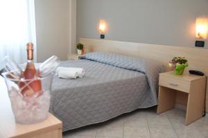Postel nebo postele na pokoji v ubytování Hotel Excelsior