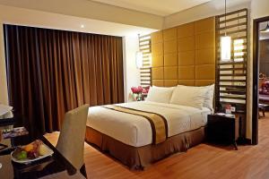 Vuode tai vuoteita majoituspaikassa The New Atrium Hotel Yogyakarta