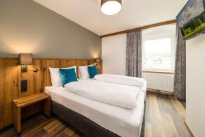 Katil atau katil-katil dalam bilik di Hotel Bräurup