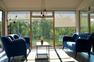 A seating area at Harpa Holiday Home - Birta Rentals