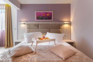 Postel nebo postele na pokoji v ubytování Hotel Maritimo