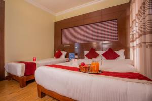 Katil atau katil-katil dalam bilik di Hotel Snowland