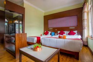 Katil atau katil-katil dalam bilik di Hotel Snowland