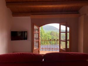 an open door to a balcony with a view at CASA RUGALL in Monrós