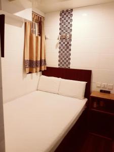 Rúm í herbergi á Simplex Guest House +7 myndir