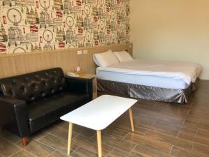Postel nebo postele na pokoji v ubytování Taroko Inn
