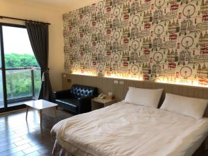 Postel nebo postele na pokoji v ubytování Taroko Inn