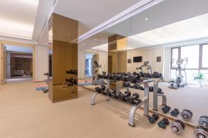a gym with treadmills and exercise equipment in a building at Xi'an Bell Tower Atour S Wu Hotel in Xi'an