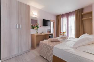 Postel nebo postele na pokoji v ubytování Hotel Maritimo