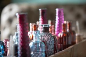 a group of glass bottles sitting on a table at Elan Hotel in Limburg an der Lahn