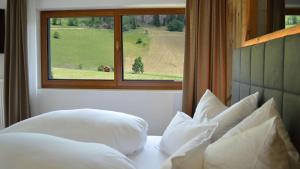 Uma cama ou camas num quarto em Hotel Trenker