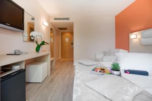 Postel nebo postele na pokoji v ubytování Hotel Maritimo