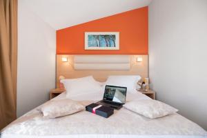 Postel nebo postele na pokoji v ubytování Hotel Maritimo