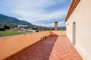 a balcony with a view of a mountain at Casa Peseta, Casa Rural in Vallada