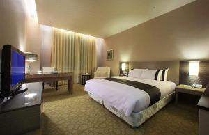 TV a/nebo společenská místnost v ubytování Shinkansen Grand Hotel