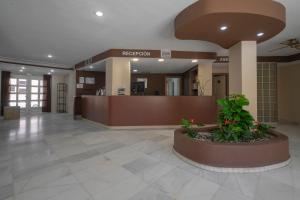 a lobby of a hospital with a reception desk at APARTAMENTOS MAR Y GOLF in Roquetas de Mar