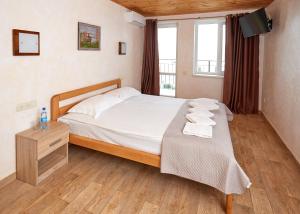 Postel nebo postele na pokoji v ubytování Tikhaya Gavan Hotel