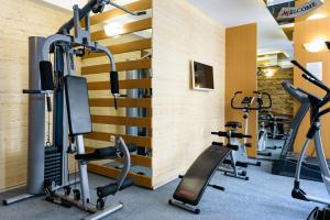 a gym with treadmills and elliptical machines at Sweet Homes Apartments in Sunny Beach