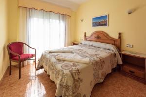 Posteľ alebo postele v izbe v ubytovaní Hostal O Camouco