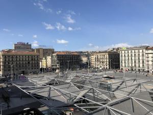a large parking lot in a city with buildings at N'Agorà B&B in Naples