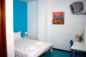 Łóżko lub łóżka w pokoju w obiekcie HI Lisboa - Pousada de Juventude