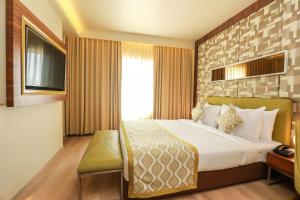 Letto o letti in una camera di IRA By Orchid Bhubaneswar