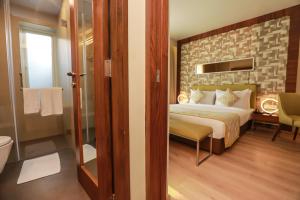 Letto o letti in una camera di IRA By Orchid Bhubaneswar